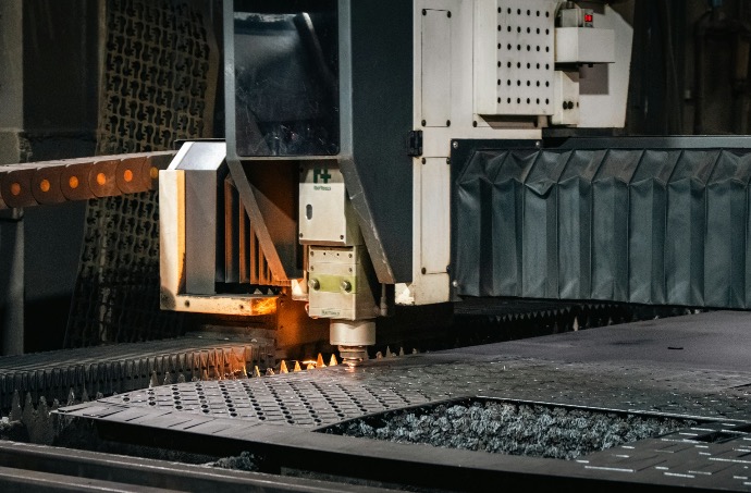 Industrial laser cutter working on metal sheet